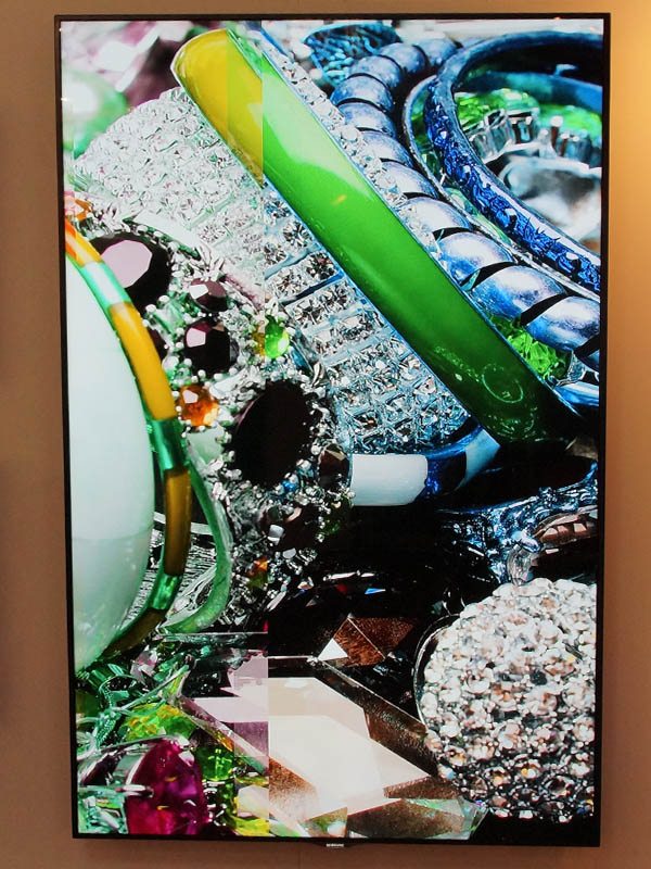 Digital artwork featuring vibrant jewelry, including rings, colorful gemstones, and beaded bracelets, displayed with a vertical strip tone effect—ideal for showcasing on the 95 Inch LED LCD Samsung ME95C rental screen.