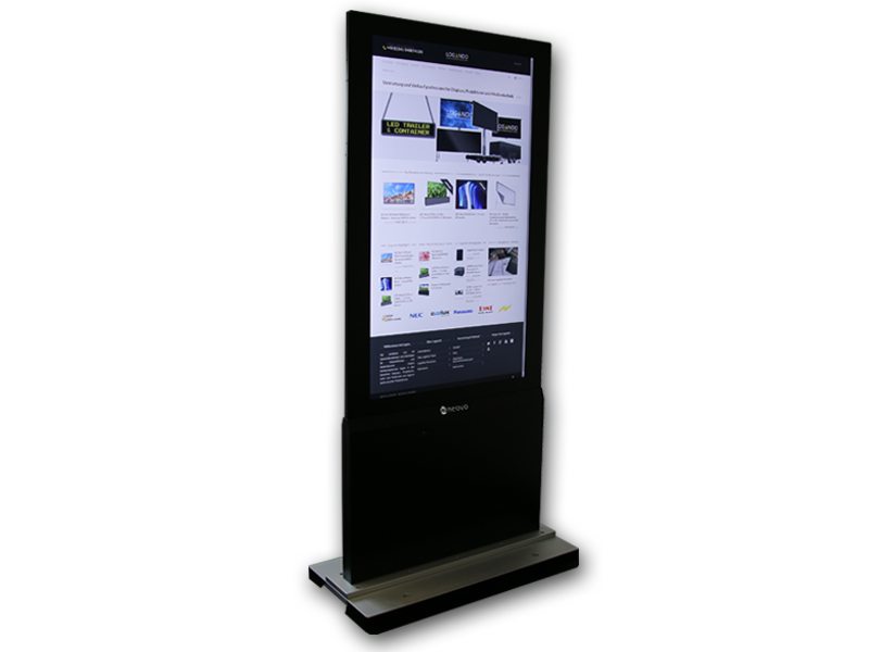 Tall freestanding digital kiosk with a black frame and sturdy black-silver base, displaying a website with images and text on its large touchscreen, set against a plain white background.