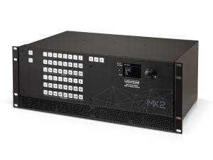 MX2 black rack-mountable AV switcher with multiple numbered white buttons, a digital display screen, and control knobs on the front panel.