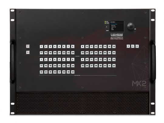Lightware MX2 rack-mounted AV matrix switcher—large black unit with labeled buttons, display screen, control knob, side handles, and front ventilation grilles. Model name “Lightware MX2” is clearly visible. Ideal for professional audiovisual signal management and switching.