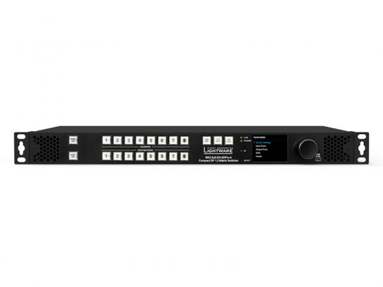 Lightware Matrix Switcher – Black professional AV matrix switch device featuring multiple labeled buttons, input/output ports, a small digital display screen, and a control knob on the right side, designed for rack-mountable audio-visual signal management in commercial or studio environments.