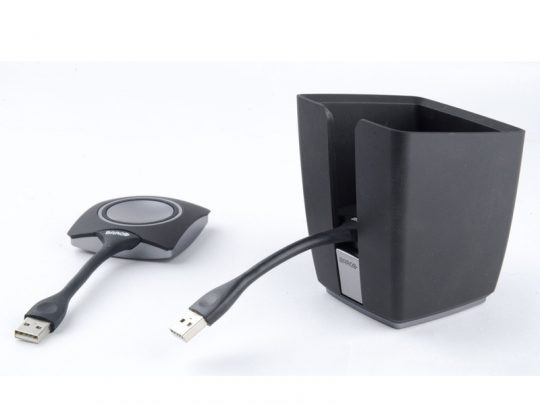 Barco CS Buttons and Tray Bundle (new) shown on a white background; includes a sleek black wireless presentation device with an attached USB cable alongside a matching black USB dongle—ideal tech accessory for seamless modern presentations.