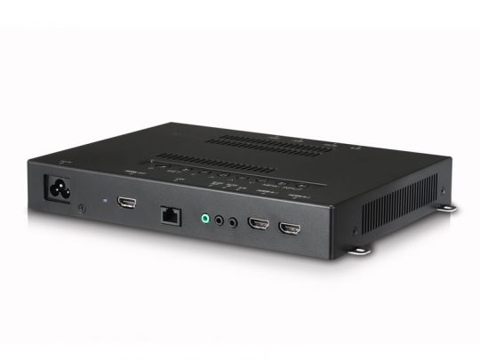 The Calibrator - LG ACC-CC-EF5E (new) features a sleek black design with rear power, USB, Ethernet, audio, and dual HDMI ports, along with ventilation slots and durable metal mounting brackets. The device is displayed against a plain white background.
