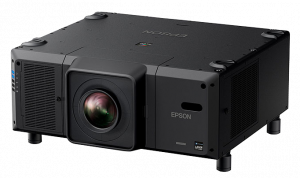 Large black Epson projector with prominent front lens, side cooling vents, and Epson logo on the right; features a sleek, rectangular design with four short legs—ideal for buyers searching for Epson projectors.