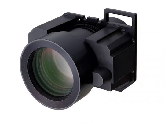 Close-up of a large black camera lens with a rectangular mounting frame, showing detailed glass elements, photographed on a white background.