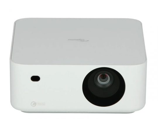 Compact white projector with rounded edges, a prominent lens on the right front side, and a small circular sensor or button on the left. The brand logo is subtly displayed on top. Perfect for home or office use.